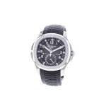 Montre d'occasion PATEK PHILIPPE Aquanaut Travel Time homme mouvement automatique certifié (cosc) bracelet caoutchouc - vue porté 3