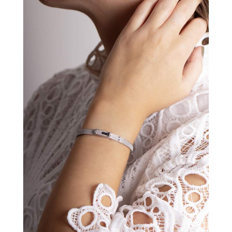 Bracelet d'occasion HERMES Kelly Petit Modèle femme or blanc 750/1000 - vue porté 2